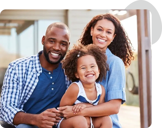 A man and woman holding a little girl.